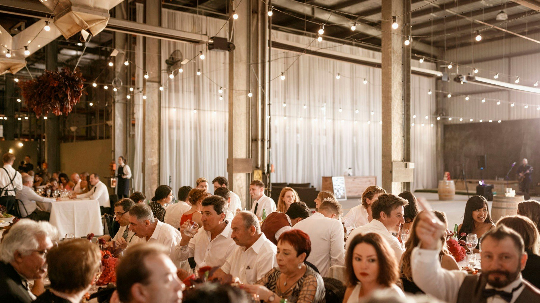 Seated guests at a wedding reception.
